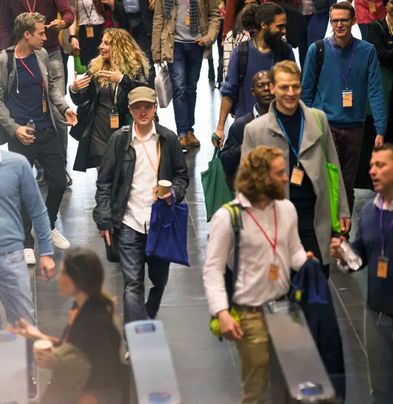 Busy conference hall with people walking and talking